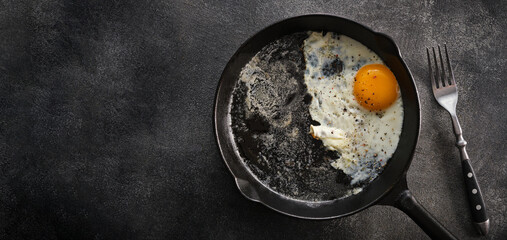 Fried chicken egg in a cast iron pan