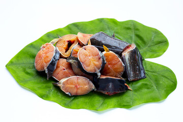 Catfish cut pieces on green leaf on white background.