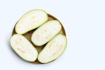 Winter melon in bamboo basket on white background.
