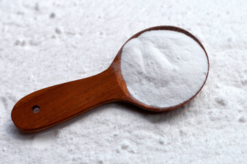 Baking soda with wooden spoon