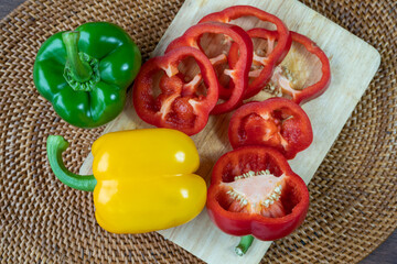 Top view Rotate Sweet red green yellow pepper on Wooden background, Sweet Bell pepper on Wooden background. 