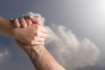 Help a friend through, support, friendship, and salvation concept. holding hands