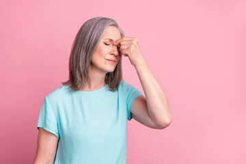 Photo of sad elder grey hairdo lady hand head wear blue blouse isolated on pink color background