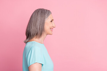 Profile photo of cute elder grey hairdo lady look empty space wear blue blouse isolated on pink color background