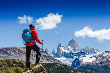 Active man hiking in the mountains. Patagonia, Mount Fitz Roy. Mountaineering sport lifestyle...
