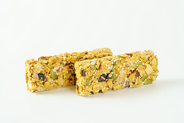 Cereal flake and dried fruit bars isolated on white background. Healthy whole grain crispy bar.