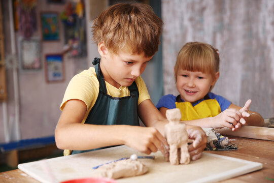 Plasticine modeling clay in children class. Clay projects teacher school.  Stock Photo by ©poznyakov 219325378