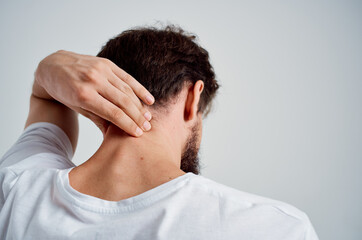 Fototapeta premium man holding neck arthritis health problems studio treatment