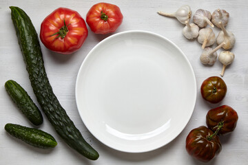 A frame of homegrown vegetables on a wooden table