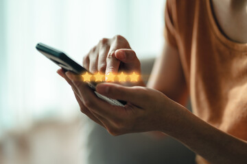 Close up of woman customer giving a five star rating on smartphone. Review, Service rating,...