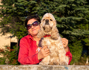 Senior woman with american cocker spaniel