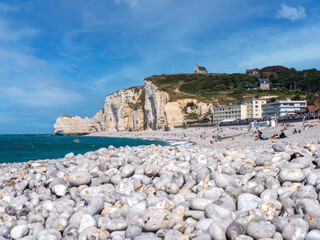 Etretat, France, Normandy.Beaches with pebbles view from below on the white kilphs the biggest...