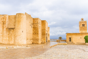 The huge, majestic walls and towers of Ribat fortress on a rainy day. Ribat is an architectural jewel of Monastir, Tunisia