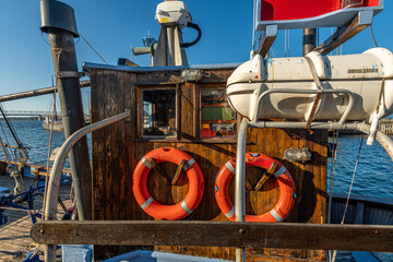 Denmark, Faaborg, 04-09-2021 old fishing cutter. lifebuoys, hanging on the wheelhouse © LeonHansenPhoto
