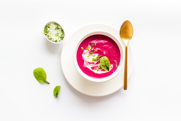 Red vegetarian beet root cream soup with herbal basil salt