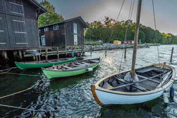 Denmark, Middelfart, 04-09-2021- Old and new wooden dinghies, are moored