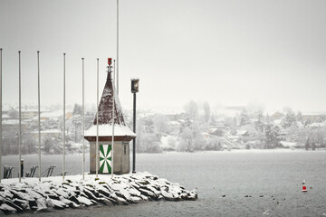 Harbour tower covered in snow. Winter