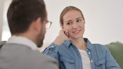 Relaxing Woman Talking with Husband at Home