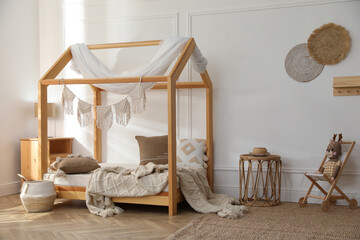 Stylish child room interior with house bed © New Africa