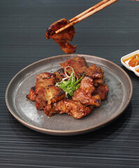 bbq grilled tender pork chop meat with sauce on dark grey wood background dim sum halal menu