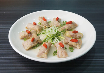 steamed chinese herbal chicken wrapped meat shape on dark grey wood background dim sum halal menu