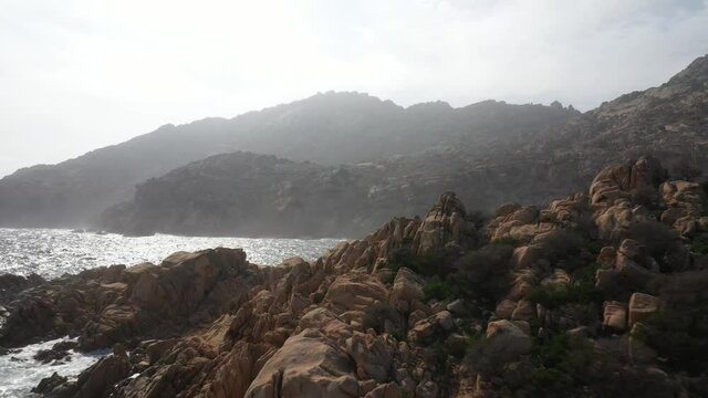 Surf Waves On Coastline Of Caprera Island In Mediterranean Sea 4K Aerial Video