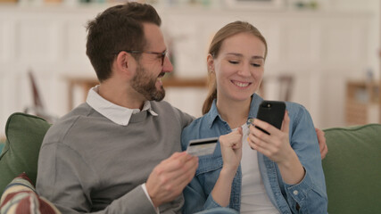 Couple making Online Shopping Payment on Smartphone
