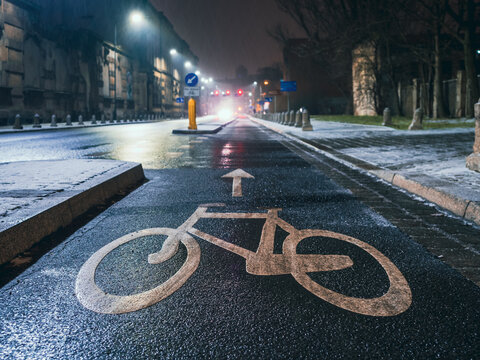 Bicycle Sign On Asphalt On A Bike Road In A Night City