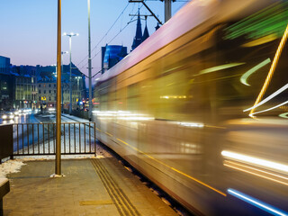 Modern tram in motion blur, city public transportation