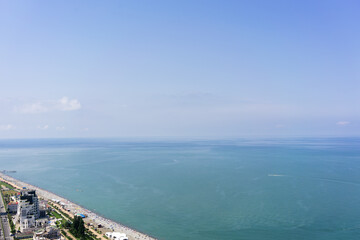 Top view of the coastal beach, blue sea and sky. Summer vacation by the sea