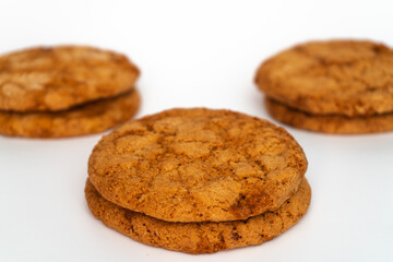 Installation of Americano cookies on a uniform background in various combinations without dishes and foreign objects