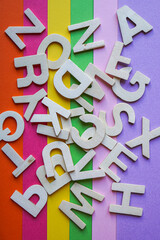 colorful wooden letters, multicolored background