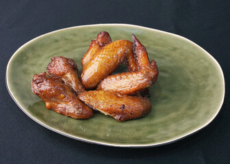 bbq grilled honey golden chicken wing on dark grey wood background fast food halal menu