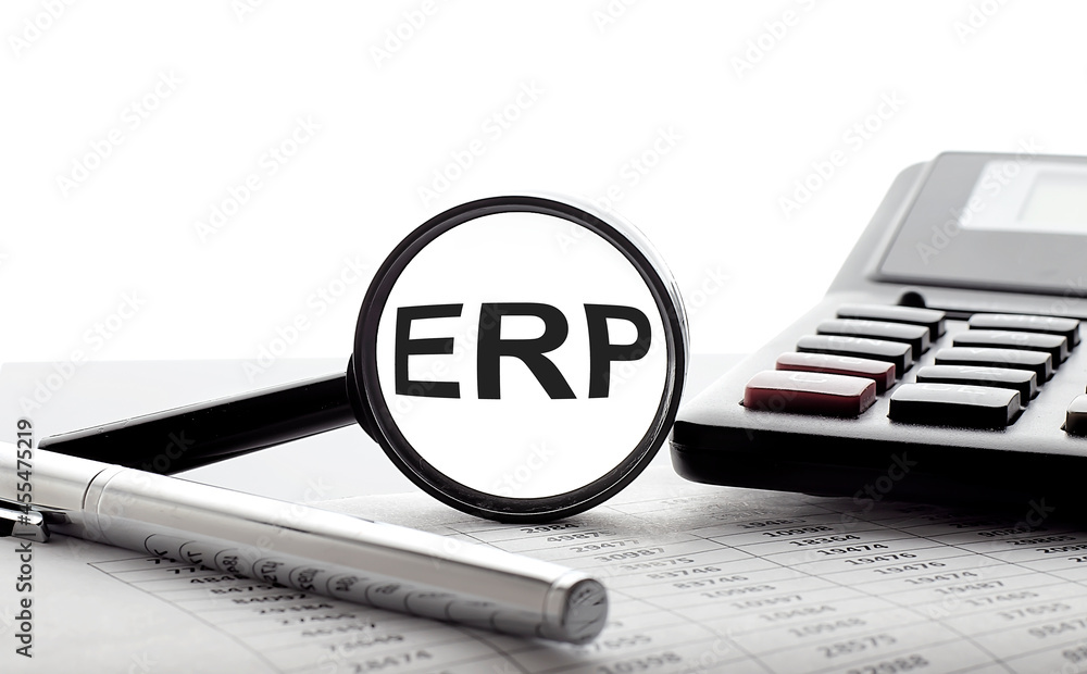 Poster erp concept. magnifier glass with text on chart with pen and calculator