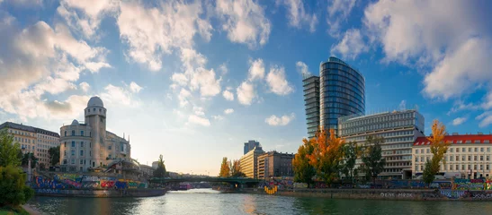 Garden poster Vienna vienna, austria - OCT 17, 2019: cityscape of vienna with danube channel. beautiful urban scenery in evening light. gorgeous sky above the skyline