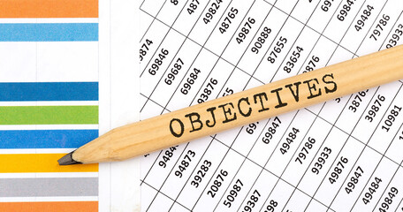 Business concept OBJECTIVES text on the pencil on the chart background