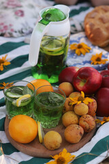 Summer picnic fruit and bread on a blanket in the