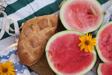 Summer picnic fruit and bread on a blanket in the