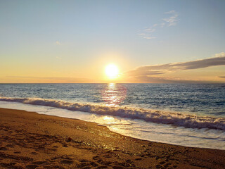 Sunset sun on sandy beach on coast of Lefkada island in Greece. Summer nature vacation travel to Ionian Sea