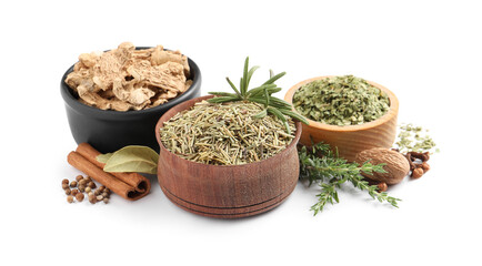 Different natural spices and herbs on white background