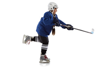 Full-length horizontal portrait of young female hockey player in blue uniform, with stick isolated over white background