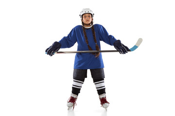 Full-length portrait of chil girl hockey player isolated over ice rink