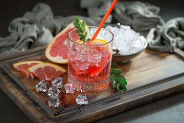 Refreshing summer alcoholic cocktail with crushed ice and citrus fruits