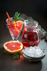 Refreshing summer alcoholic cocktail with crushed ice and citrus fruits