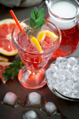 Refreshing summer alcoholic cocktail with crushed ice and citrus fruits
