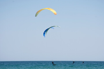 A man practicing Kitesurfing in the ocean
