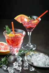 Glasses of wine on a black background.