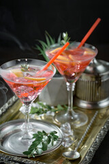 Fruit cocktail, in a glass with natural healthy fruits on a table with kitchen accessories.