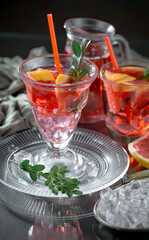 Refreshing summer alcoholic cocktail with crushed ice and citrus fruits