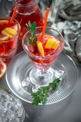 Refreshing summer alcoholic cocktail with crushed ice and citrus fruits